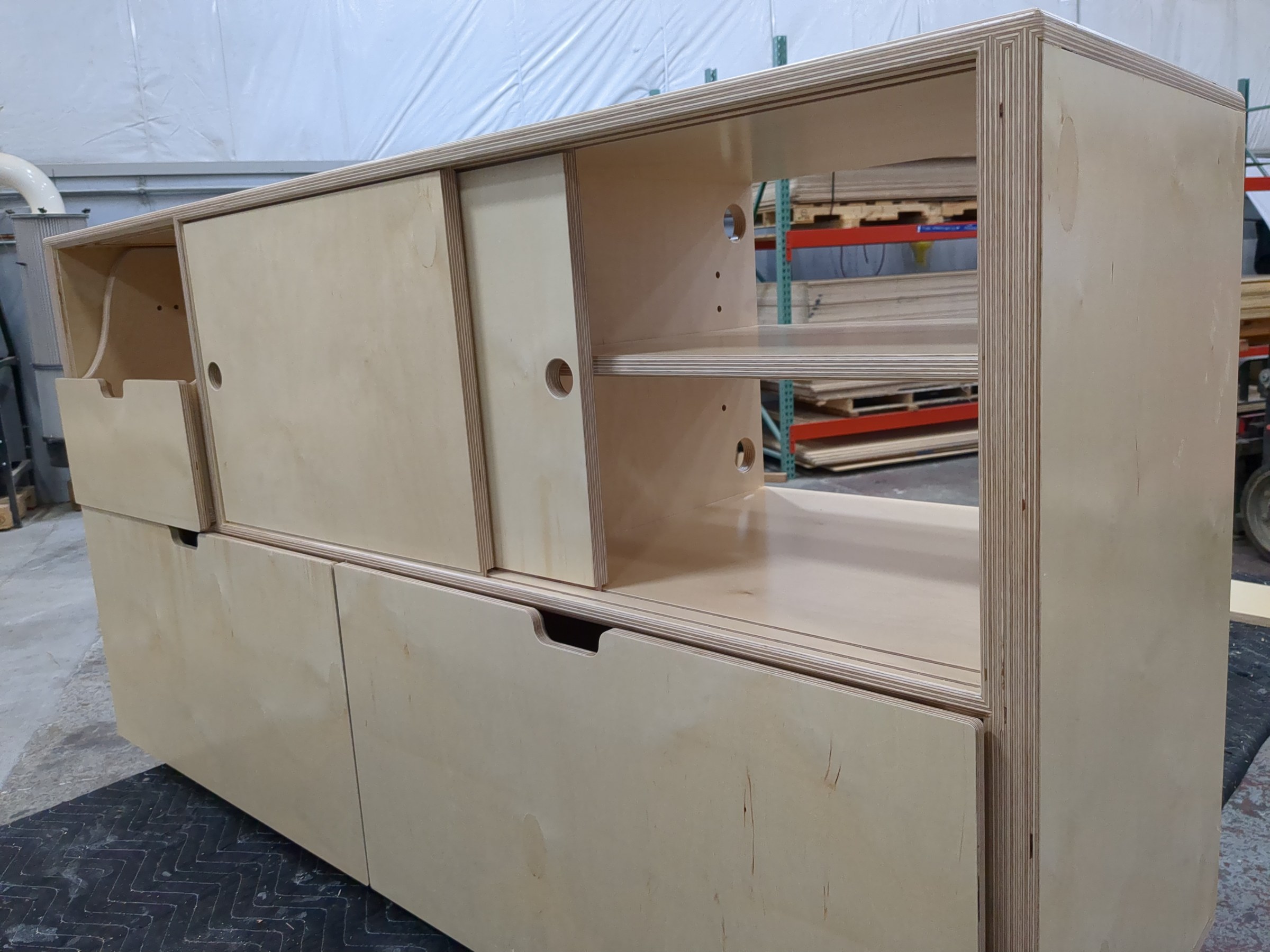 Shelf with sliding door partially open