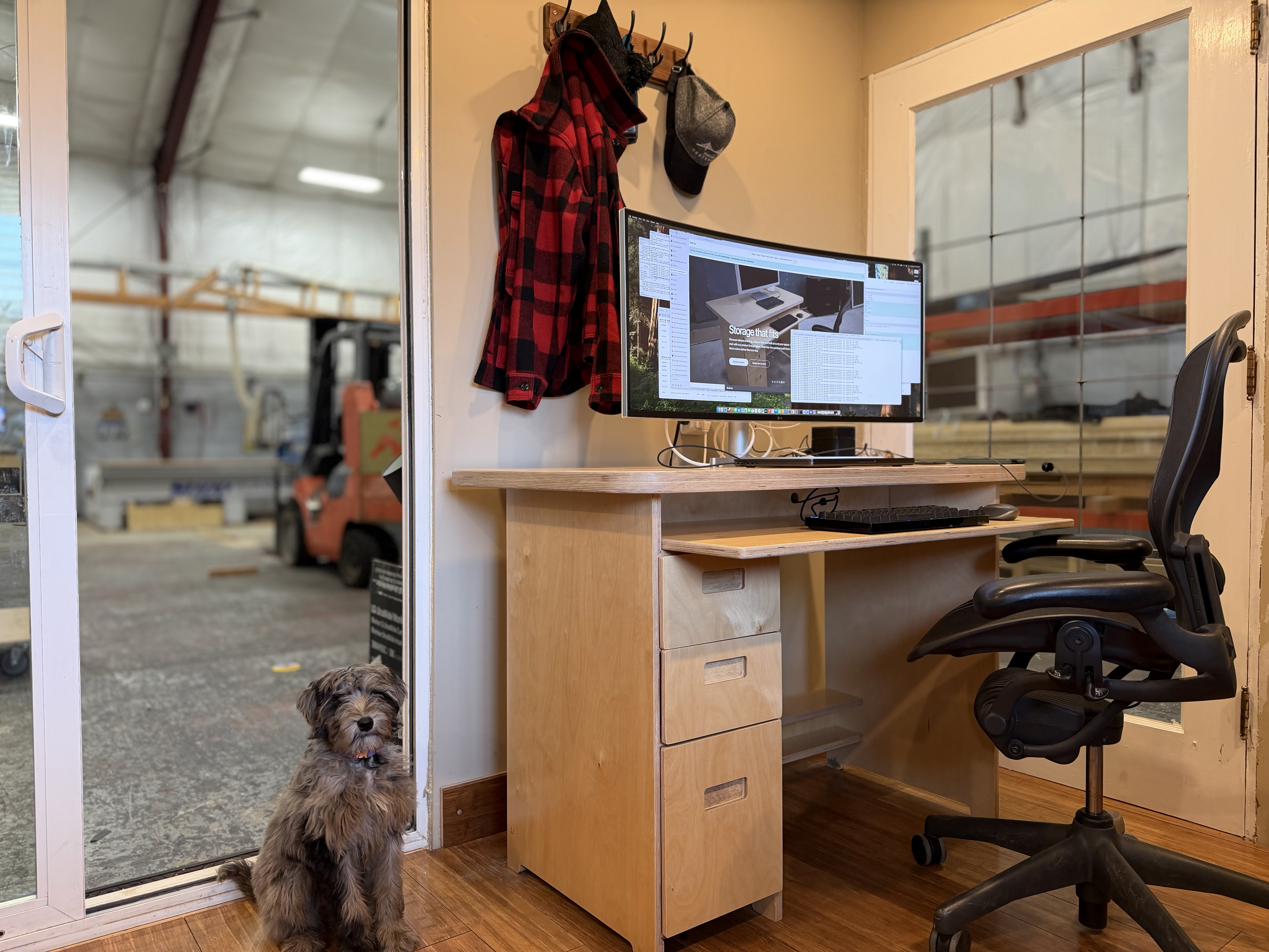 A strong, custom desk with a slide out keyboard tray and drawers for a home office