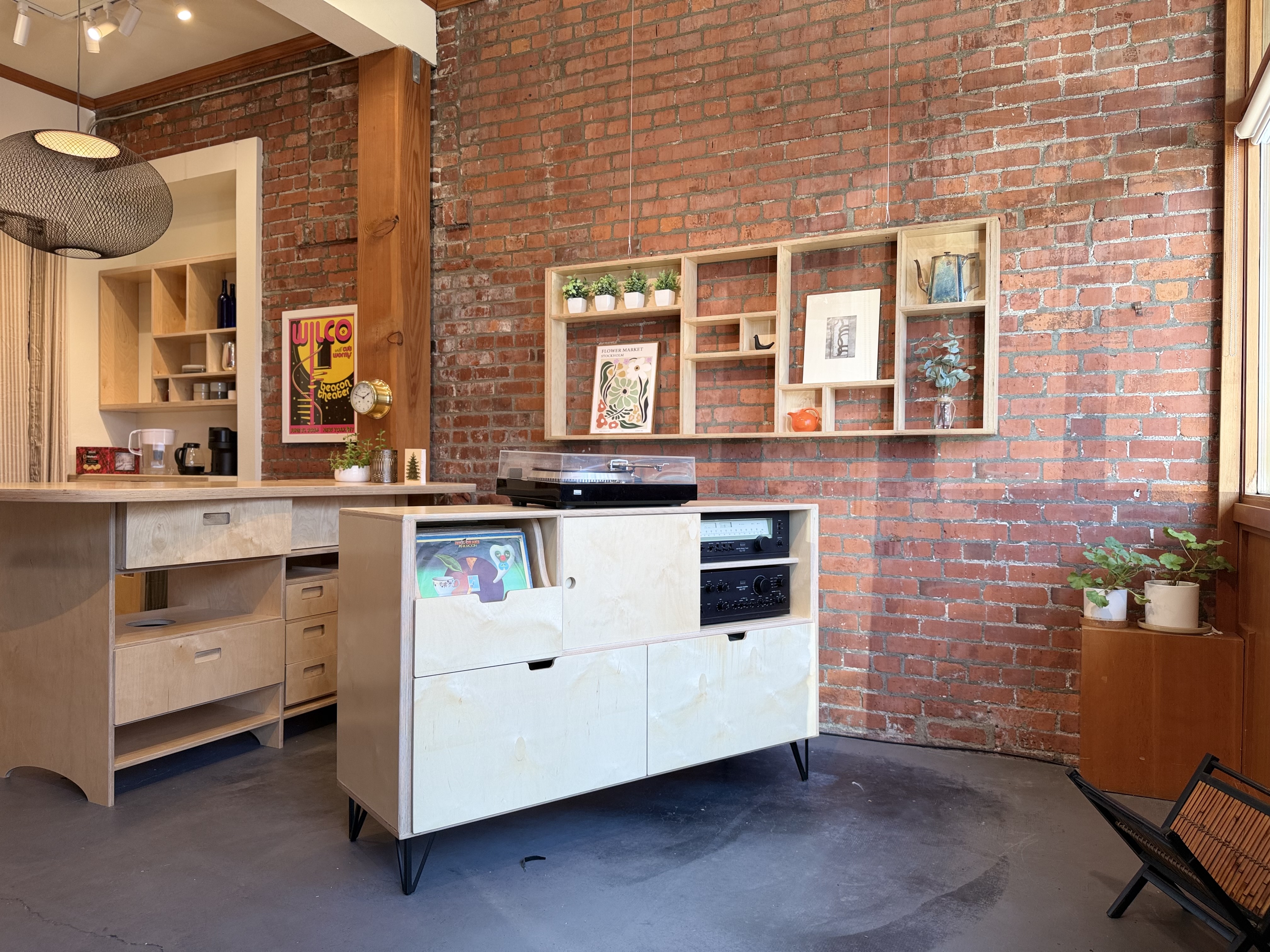 A strong, console-style storage system for hi fi components, records, and a turntable