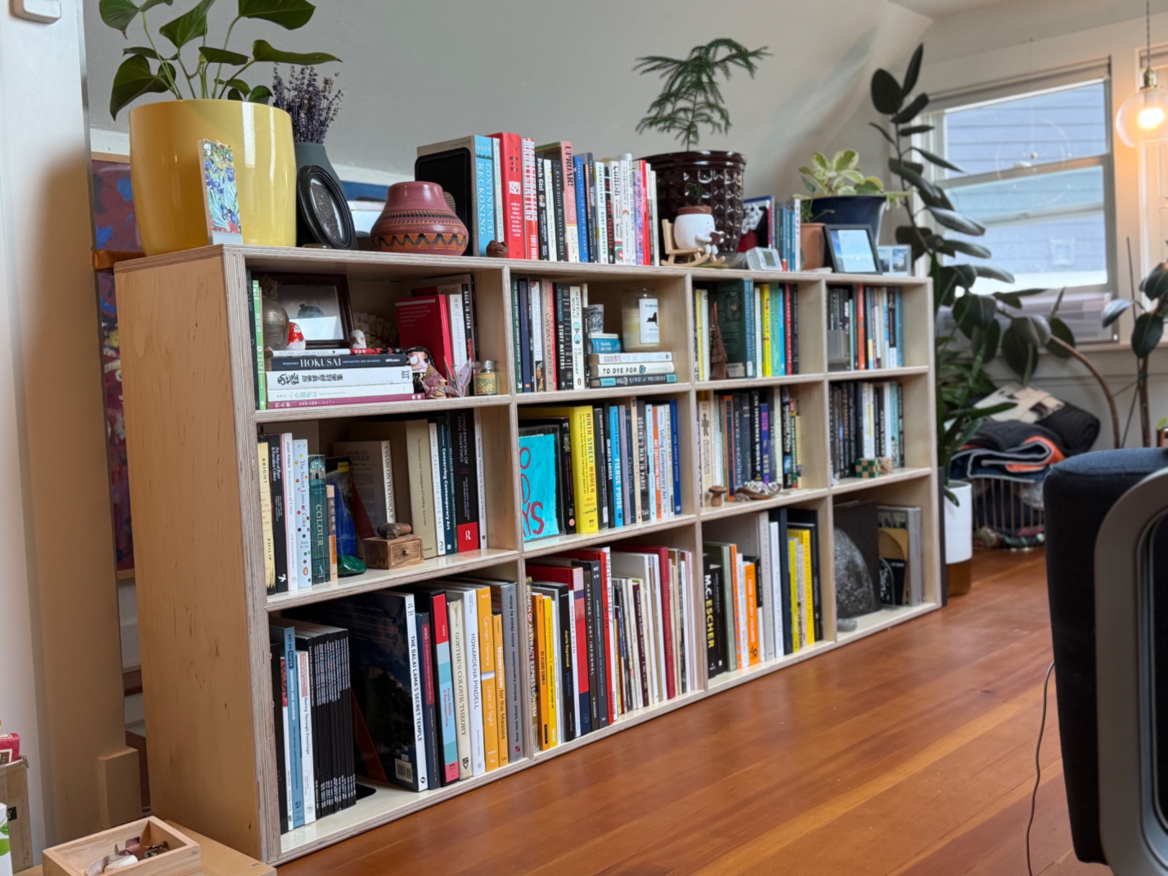 Large custom birch bookcase shown with books and decor